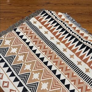 Geometric Patterned Rug in Black, White, and Brown